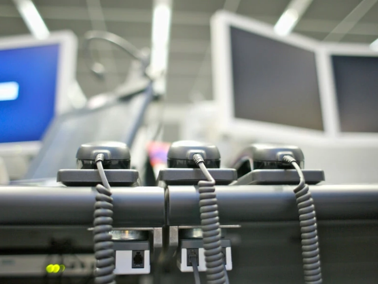 telephones-on-desk-at-stock-market-2025-10-16-23-26-00-utc